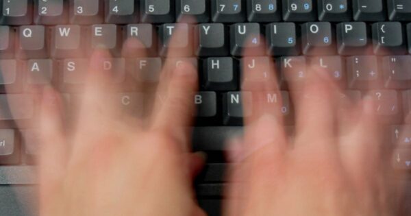 Website designer typing SEO content