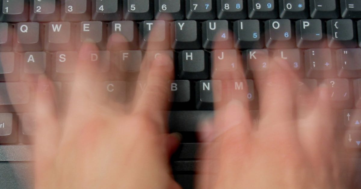 Website designer typing SEO content